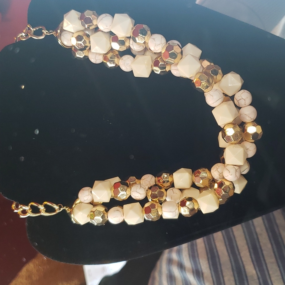 Four-Strand Beaded Necklace. *H